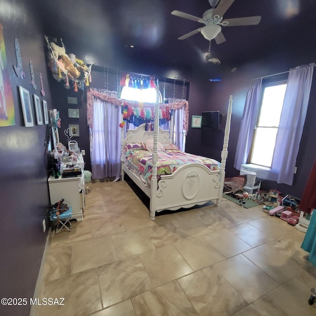 bedroom featuring a ceiling fan and tile patterned floors