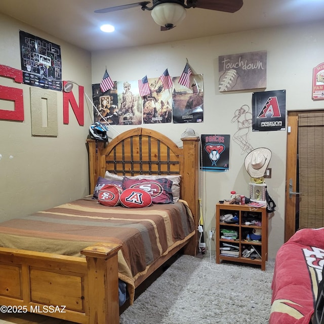 carpeted bedroom featuring a ceiling fan