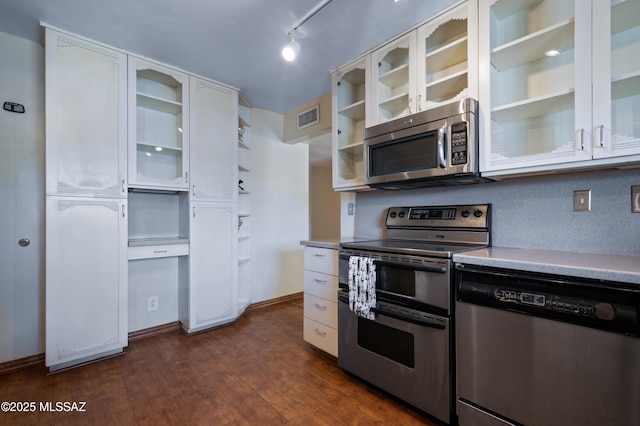 kitchen with visible vents, dark wood finished floors, light countertops, appliances with stainless steel finishes, and white cabinets