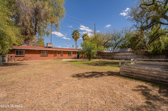 view of yard featuring a patio and fence