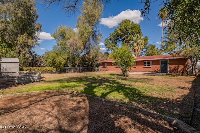 view of yard featuring fence