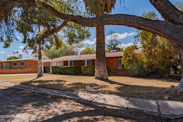 ranch-style home with brick siding