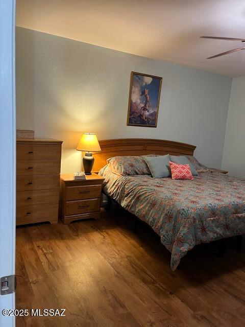 bedroom featuring ceiling fan and wood finished floors