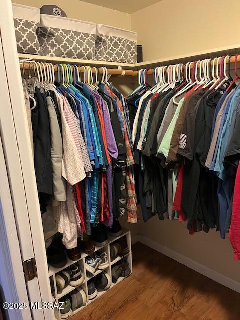 spacious closet featuring wood finished floors