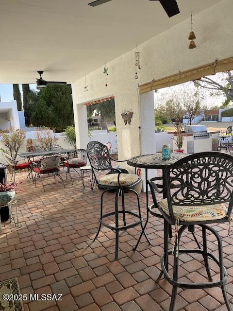 view of patio / terrace featuring ceiling fan and outdoor dining area