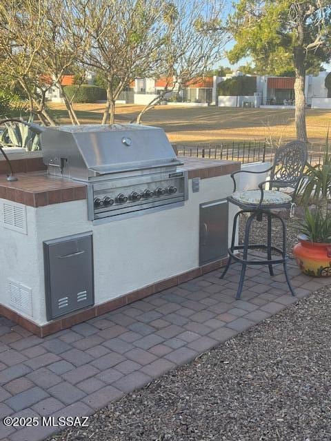 view of patio featuring area for grilling and visible vents