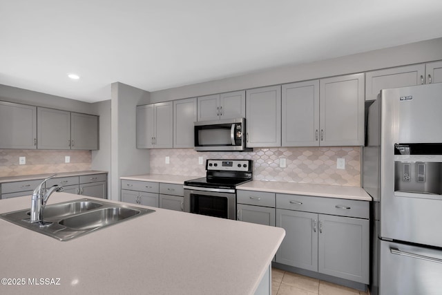 14241 E Bolster Dr, Vail, AZ 85641 - kitchen featuring stainless steel appliances, gray cabinets, a sink, tasteful backsplash, and recessed lighting