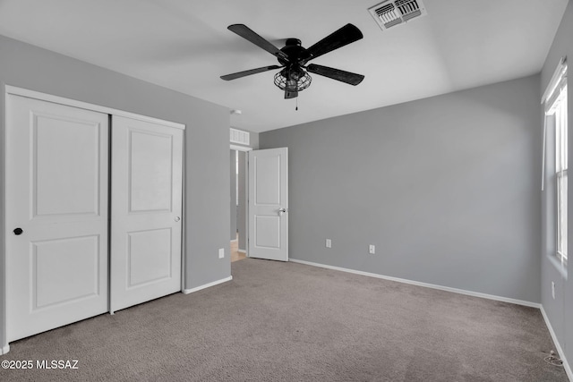14241 E Bolster Dr, Vail, AZ 85641 - unfurnished bedroom with carpet, baseboards, a closet, and a ceiling fan