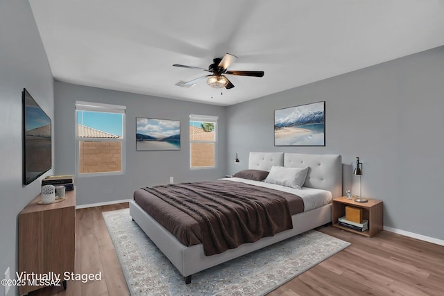 14241 E Bolster Dr, Vail, AZ 85641 - bedroom featuring wood finished floors, baseboards, and a ceiling fan