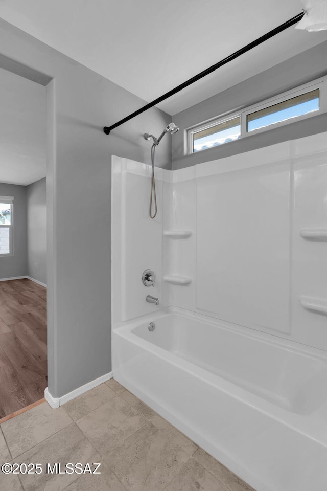 14241 E Bolster Dr, Vail, AZ 85641 - bathroom featuring baseboards and  shower combination