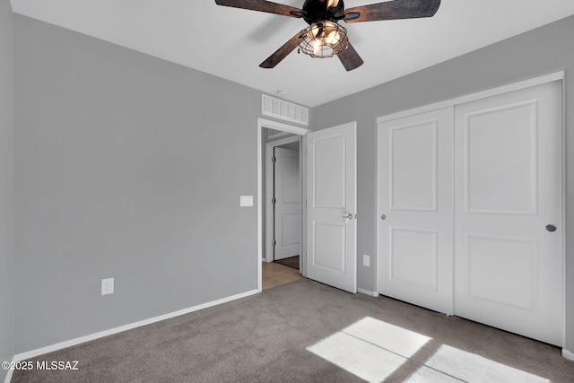 14241 E Bolster Dr, Vail, AZ 85641 - unfurnished bedroom with carpet, baseboards, ceiling fan, and a closet