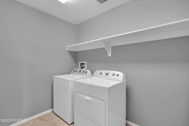 14241 E Bolster Dr, Vail, AZ 85641 - laundry room featuring independent washer and dryer, baseboards, and light tile patterned flooring