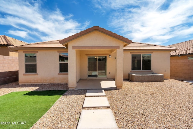 14241 E Bolster Dr, Vail, AZ 85641 - rear view of property with fence, a patio, stucco siding, and a tiled roof