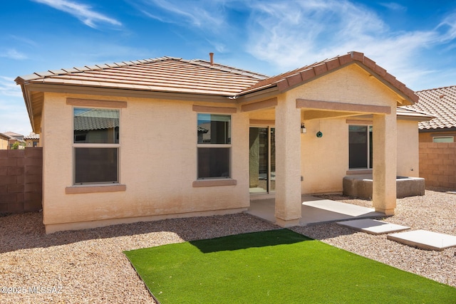 14241 E Bolster Dr, Vail, AZ 85641 - back of property featuring fence, a tiled roof, stucco siding, and a patio