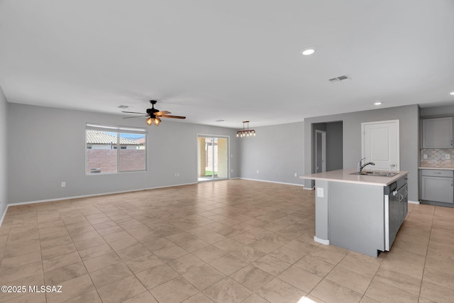 14241 E Bolster Dr, Vail, AZ 85641 - unfurnished living room featuring a sink, ceiling fan, light tile patterned floors, recessed lighting, and baseboards