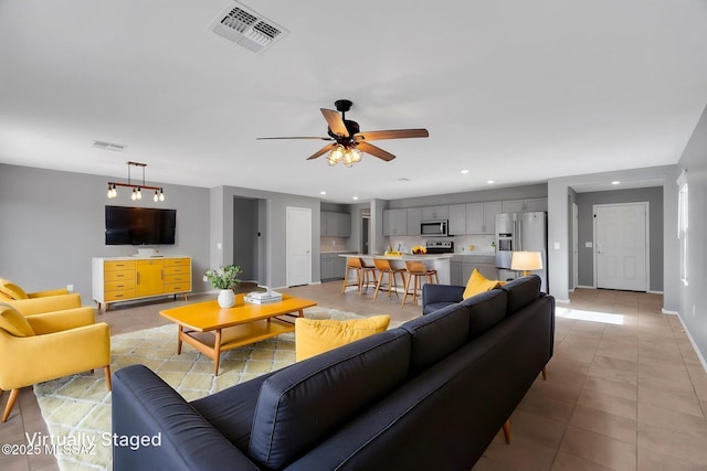 14241 E Bolster Dr, Vail, AZ 85641 - living room featuring a ceiling fan, light tile patterned floors, recessed lighting, and baseboards