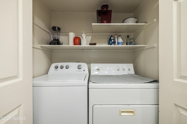 clothes washing area with laundry area and washing machine and dryer