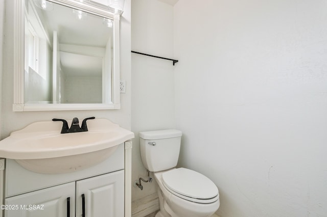bathroom with toilet and vanity