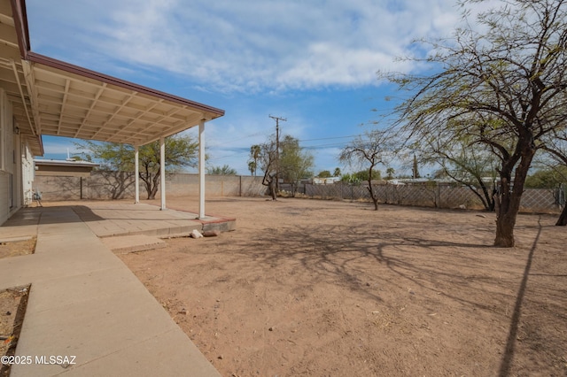 view of yard with a patio area and a fenced backyard