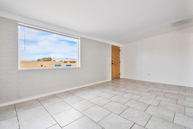 spare room featuring visible vents