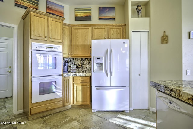 13517 N Heritage Gateway Ave, Marana, AZ 85658 - kitchen with white appliances, backsplash, and light stone countertops