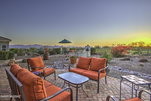 13517 N Heritage Gateway Ave, Marana, AZ 85658 - view of patio / terrace featuring an outdoor living space, a mountain view, outdoor dining space, and fence