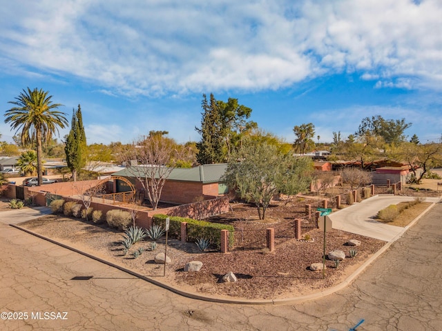 view of front of house featuring fence