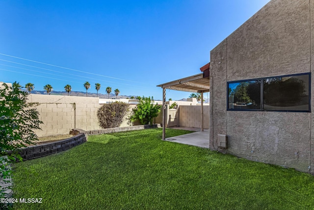 view of yard featuring a patio area, a fenced backyard, and a pergola