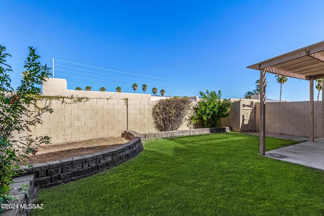 view of yard with a fenced backyard