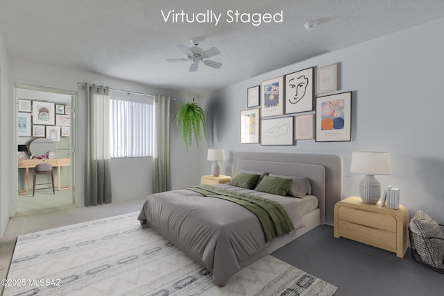 bedroom featuring carpet, ceiling fan, and a textured ceiling