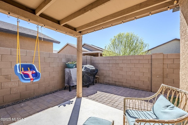 view of patio / terrace with a fenced backyard and area for grilling