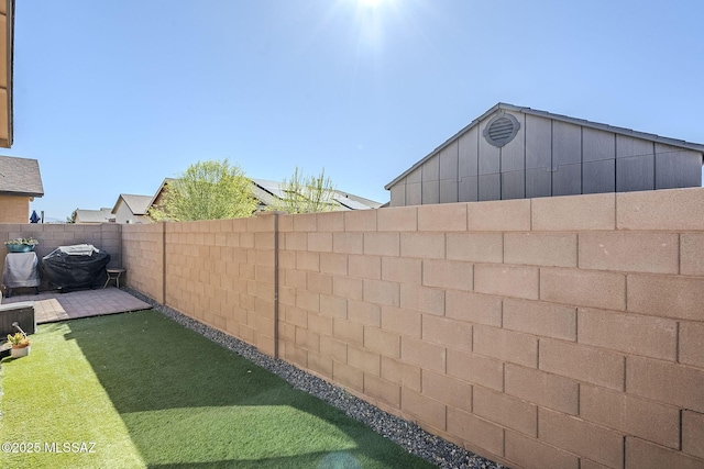 view of yard with a fenced backyard