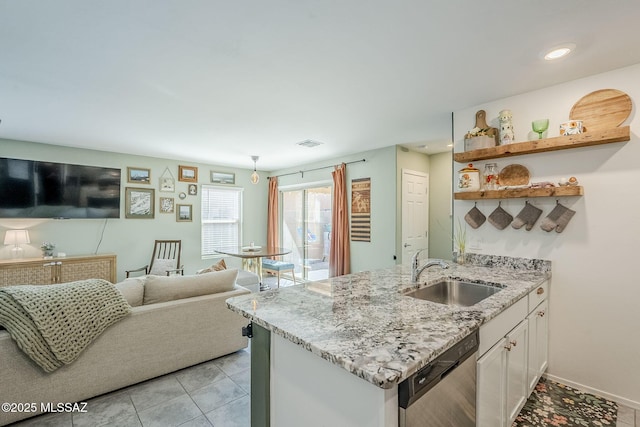 kitchen featuring visible vents, dishwasher, white cabinetry, open shelves, and a sink