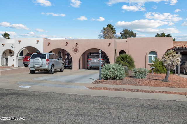 view of property featuring driveway and an attached garage