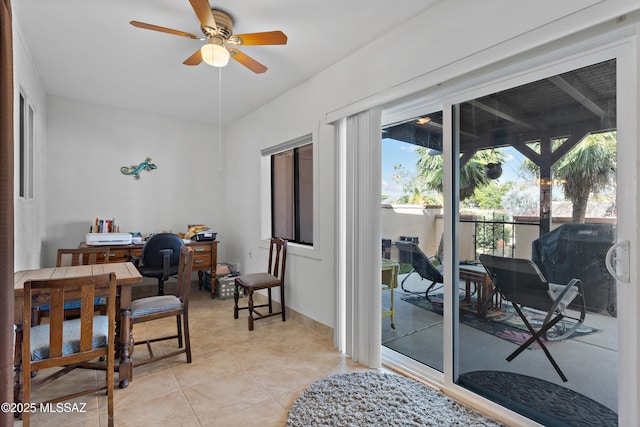 office featuring ceiling fan, light tile patterned flooring, and a sunroom