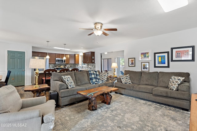 living area featuring a ceiling fan