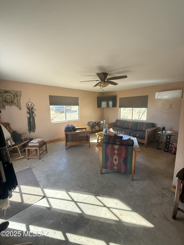 living room featuring concrete flooring, a healthy amount of sunlight, a wall mounted air conditioner, and a ceiling fan