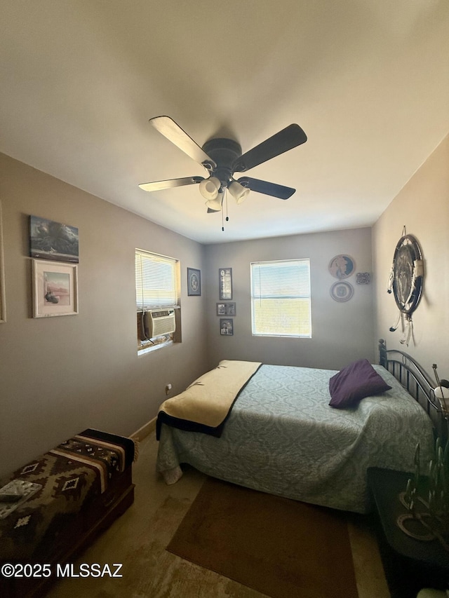 bedroom with carpet, a ceiling fan, and cooling unit