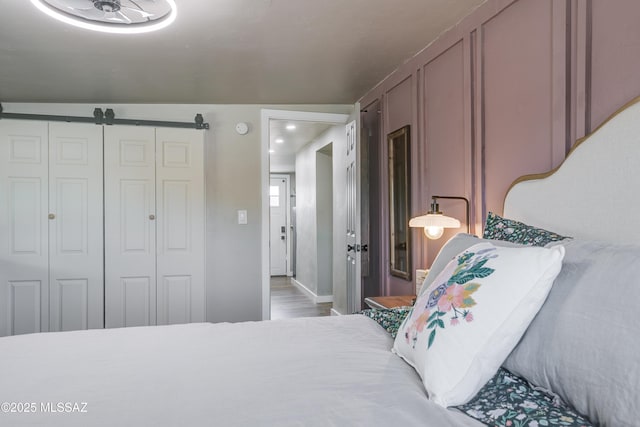 bedroom featuring a closet and wood finished floors