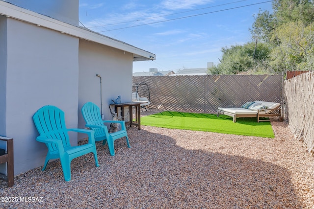 view of yard with a fenced backyard and a patio