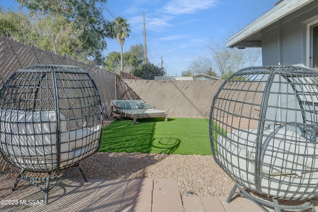 view of yard with a patio and a fenced backyard