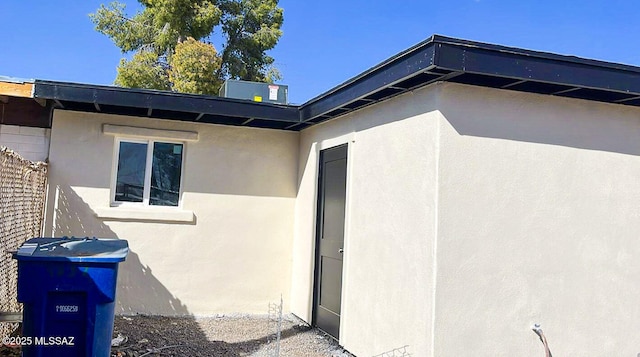 doorway to property with stucco siding