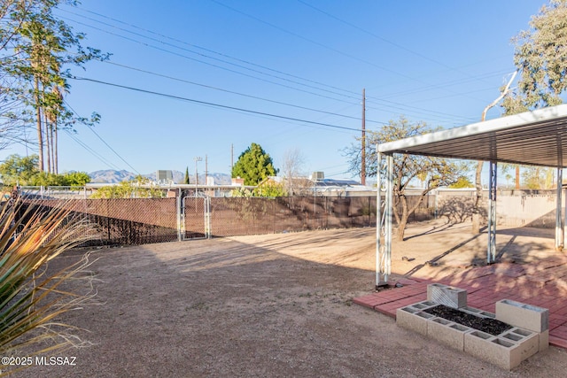 view of yard featuring a gate and fence