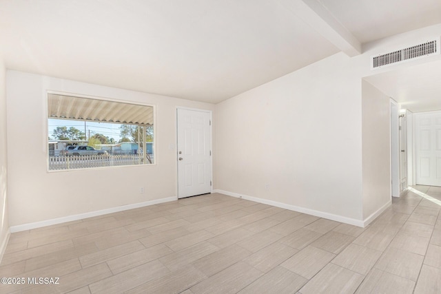 unfurnished room with vaulted ceiling with beams, light wood-style floors, baseboards, and visible vents