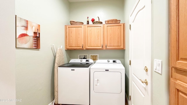 laundry area featuring cabinet space and washing machine and dryer