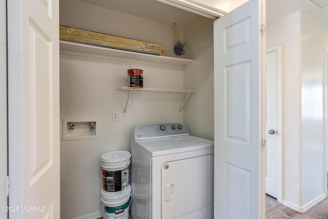 washroom featuring laundry area and washer / clothes dryer