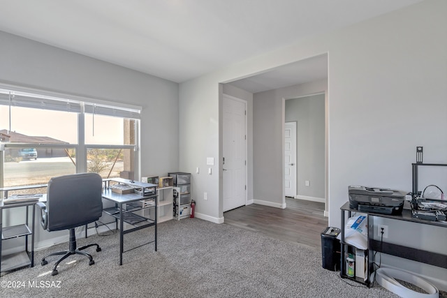 home office with carpet and baseboards