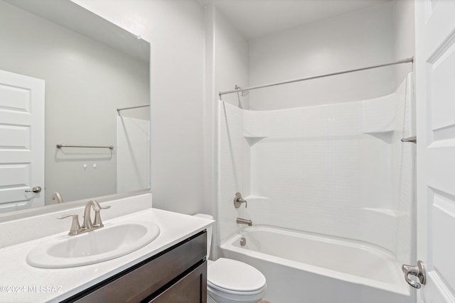 full bathroom with washtub / shower combination, vanity, and toilet