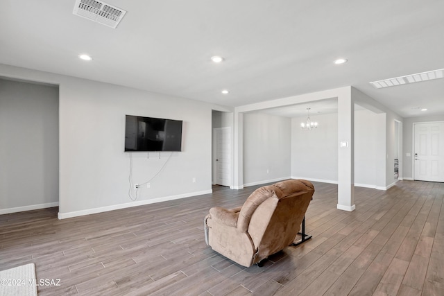 interior space with recessed lighting, visible vents, and wood finished floors