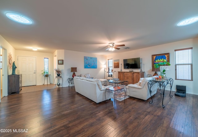 living area featuring ceiling fan and hardwood / wood-style flooring